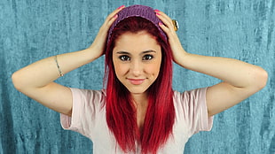 woman with red hair in purple knit hat and pink t-shirt HD wallpaper