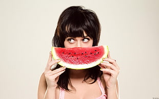 woman holding sliced of watermelon HD wallpaper