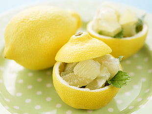 Sliced Lemon on green ceramic plate