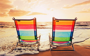 two multicolored beach loungers on beach at golden our HD wallpaper