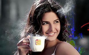 woman holding white ceramic cup white smiling HD wallpaper