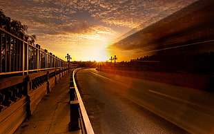 asphalt road under yellow sunset timelapse shot