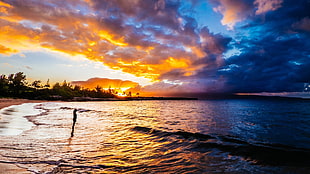 body of water over horizon during dawn