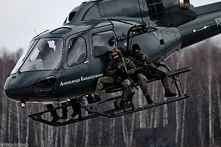 gray helicopter with two soldiers HD wallpaper