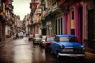 Cars Parked Near Buildings during Daytime HD wallpaper