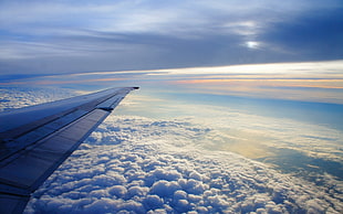 aerial view of airplane wing above clouds HD wallpaper