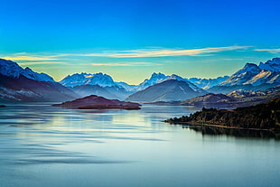 mountains near body of water during daytime HD wallpaper
