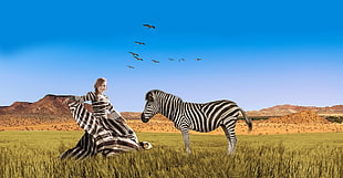 photo of woman wearing black and white zebra print dress while zebra next to her HD wallpaper