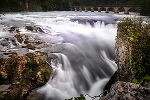 time lapse photography of river near suspension bridge at daytime HD wallpaper