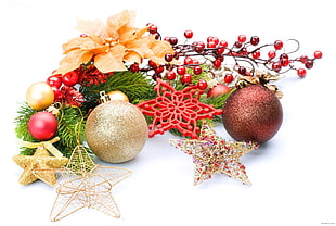 closeup photo of Christmas ornaments on white surface