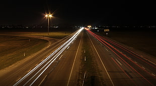 time lapsed photography of concrete pavement road