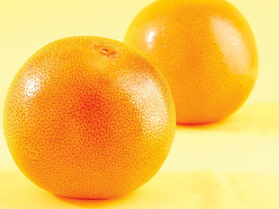 two round orange fruits HD wallpaper