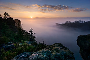 view top of the mountains with fogs and sunrise