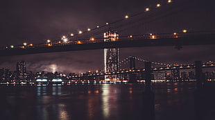 lighted Brooklyn Bridge at night HD wallpaper