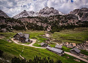 village with mountain range view during daytime, italy