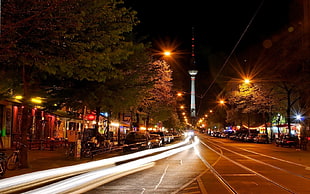 timelapse photography of street near white tower during nighttime HD wallpaper