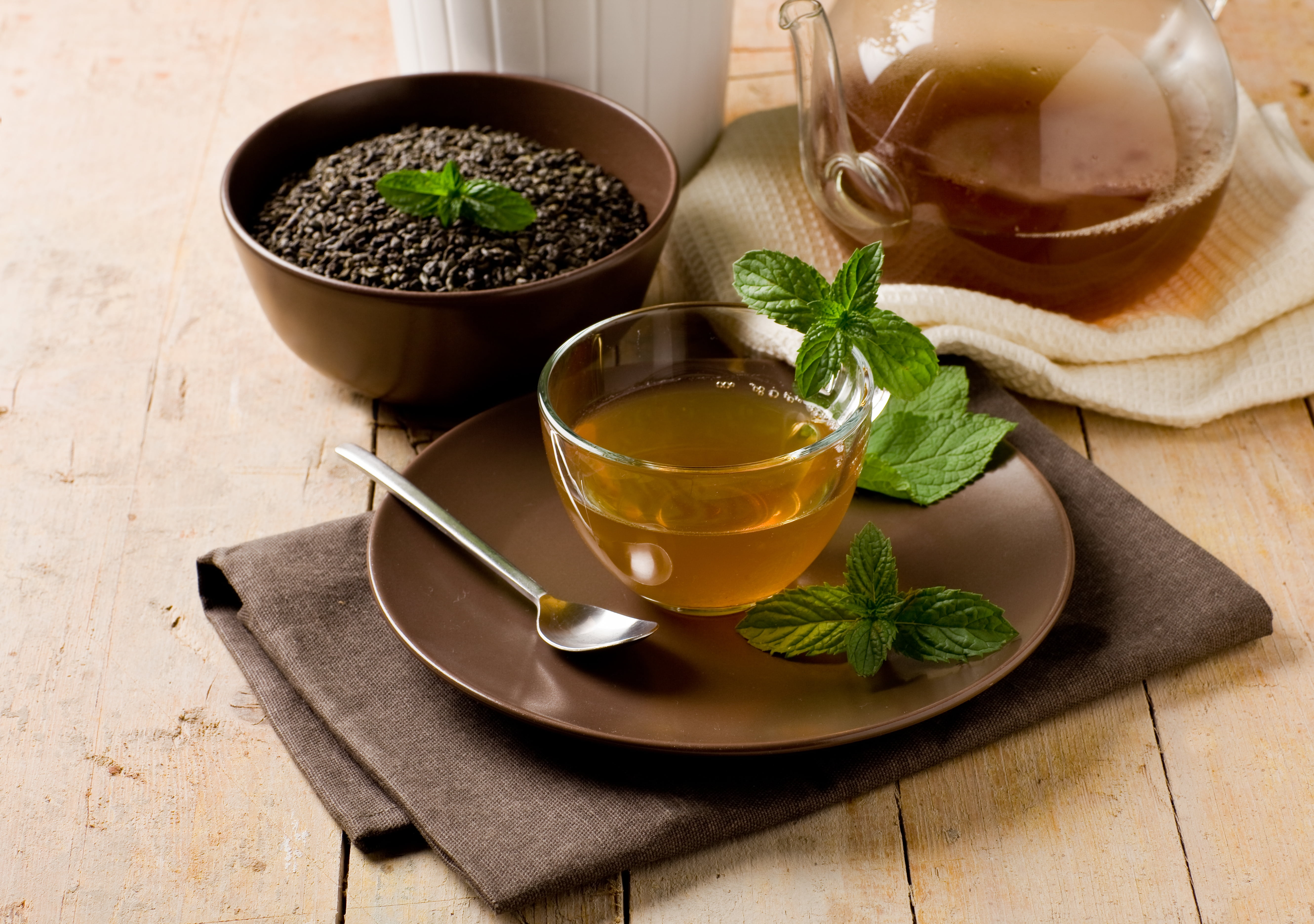 clear glass tea cup with oolong tea herb and tea in cup