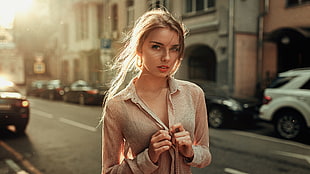 blonde haired woman wearing brown button-up shirt