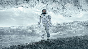 astronaut walking on gray surface HD wallpaper