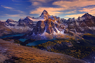 body of water beside hills under blue cloudy sky during daytime digital wallpaper