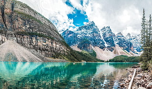 blue body of water with gray mountain