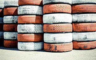 orange and white vehicle tire lot, tires, rubber