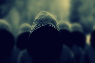 selective focus photography of people wearing black hooded jacket during daytime HD wallpaper