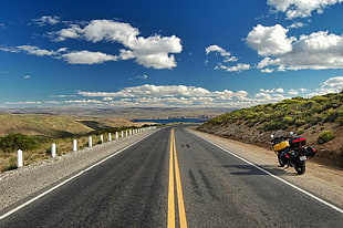 black motorcycle beside asphalt road, argentina