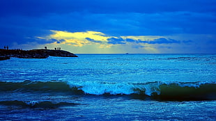 waves overlooking island during twilight HD wallpaper