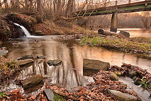 river and stones painting beside bridge painting, susquehanna