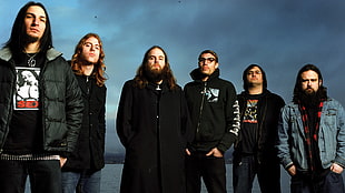 six men wearing jacket standing near on body of water HD wallpaper