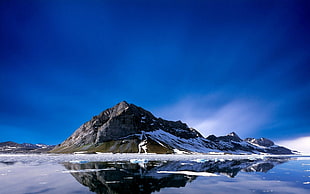 black mountain filled by snow