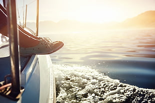 woman wearing blue boat shoes sitting on white boat HD wallpaper