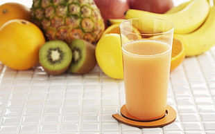 clear drinking glass with fruit juice