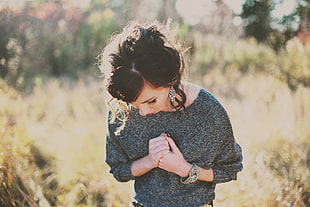 woman in gray scoop neck long sleeve shirt