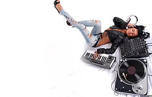 woman lying on a terminal mixer while holding a electronic keyboard HD wallpaper