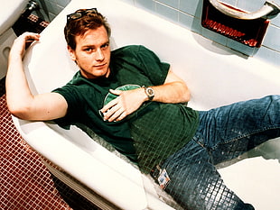 man in green shirt and blue jeans in bath tub HD wallpaper