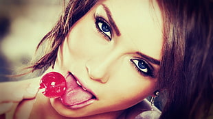 woman licking red lollipop HD wallpaper