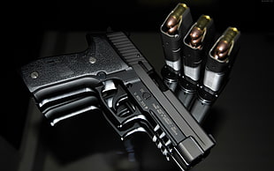 black semi automatic pistol beside bullets HD wallpaper
