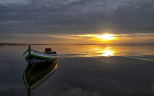 white boat on calm water during sunset HD wallpaper