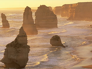 rock formation on body of water