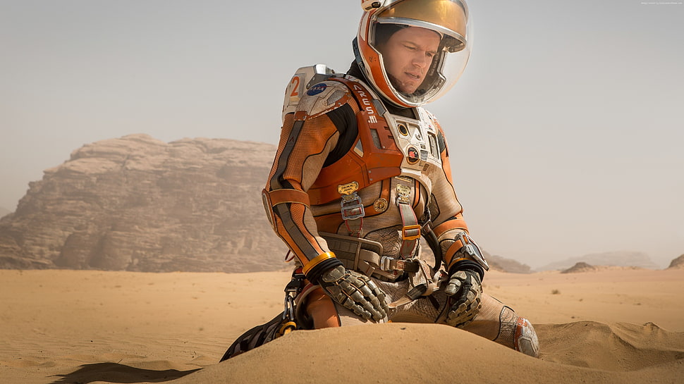 man in astronaut suit with desert background HD wallpaper