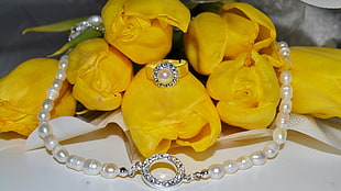 white pearl necklace and yellow petaled flowers HD wallpaper