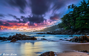 horizons photography of seashore rocks and clouds