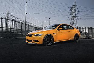 yellow BMW M3 E92 coupe