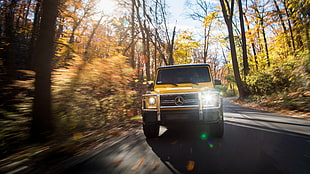 yellow Mercedes-Benz G-class SUV on asphalt road HD wallpaper