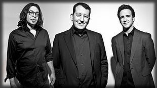 grayscale photo of three men