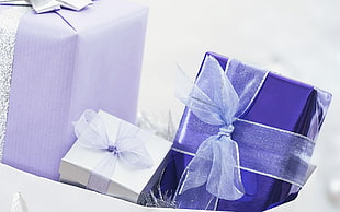 three purple and white gift boxes HD wallpaper