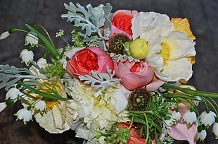 red, white, and yellow petaled flower arrangement