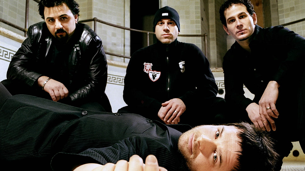 four men wearing black suit rock band HD wallpaper